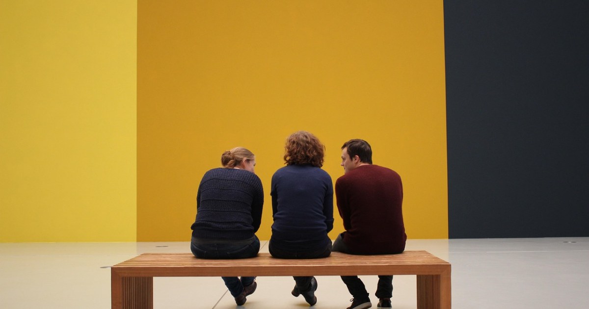 Museum visitors in an art gallery for a culture discovery trends guide.