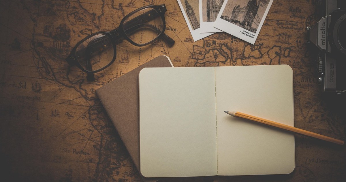 Travel map and computer for a travel planning AI tools guide.