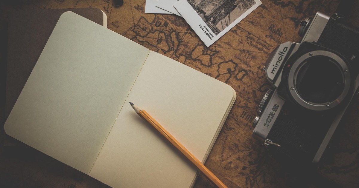 Map and laptop travel planning scene for 2026 travel decision trends.