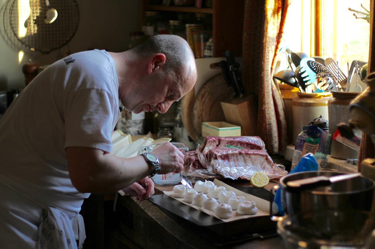A chef cooking food in a restaurant kitchen, illustrating cooking competition shows.